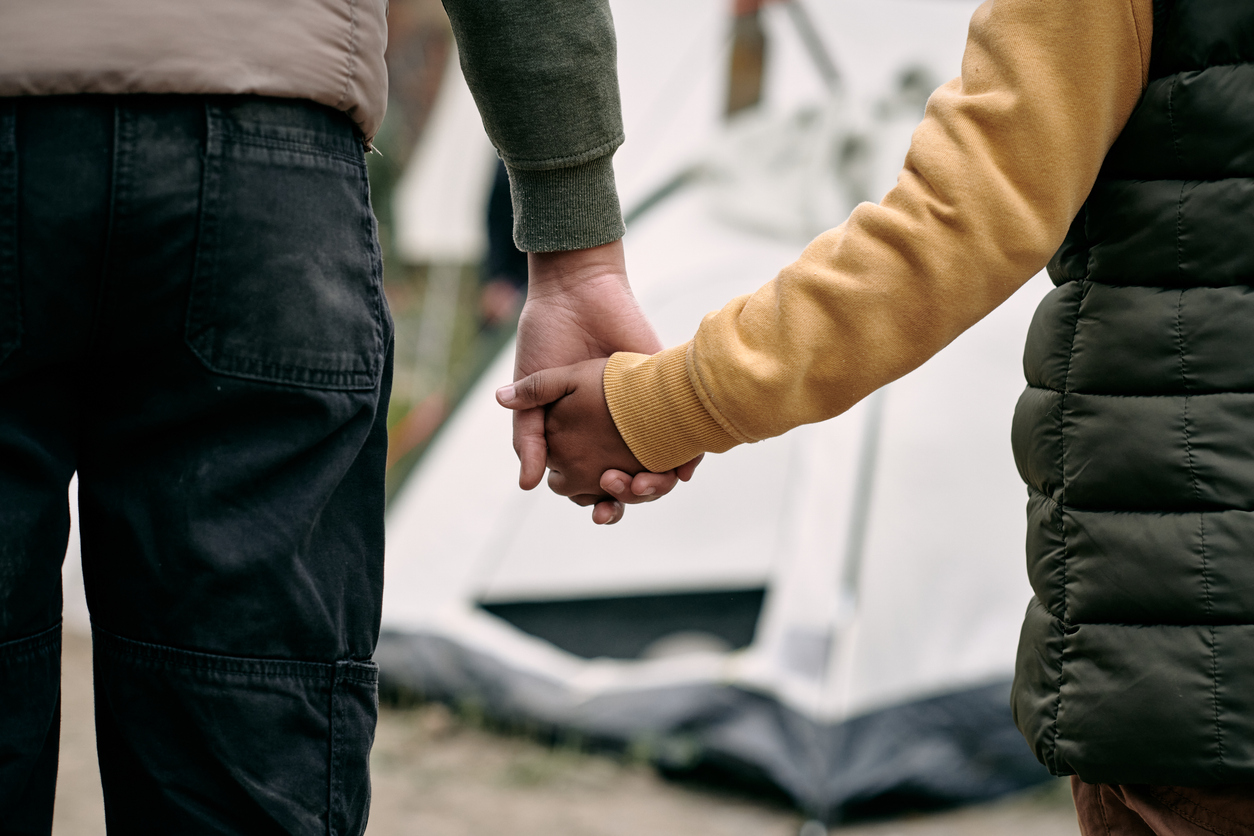 father and child holding hands